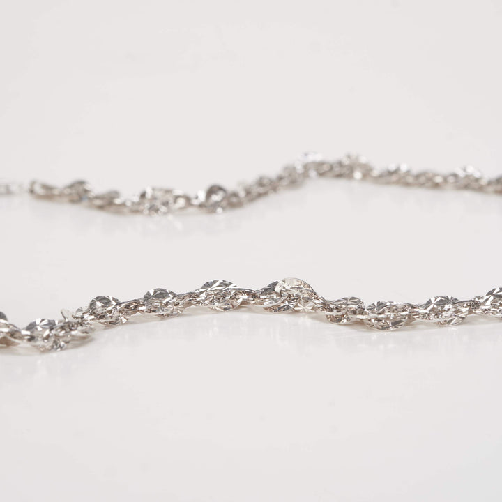 Dây chuyền trắng ovan xoắn móc máy Bảo Tín K&K Vàng kiểu Ý 750